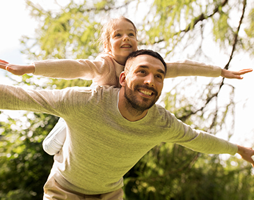 Father and child playing outdoors